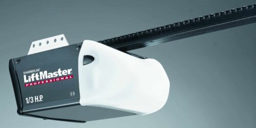 Close-up of an automatic garage door opener motor on the ceiling.