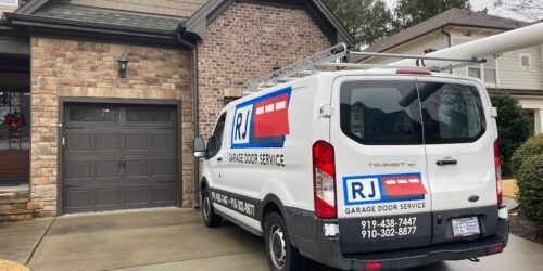 RJ Garage Door Service Car in front of a house
