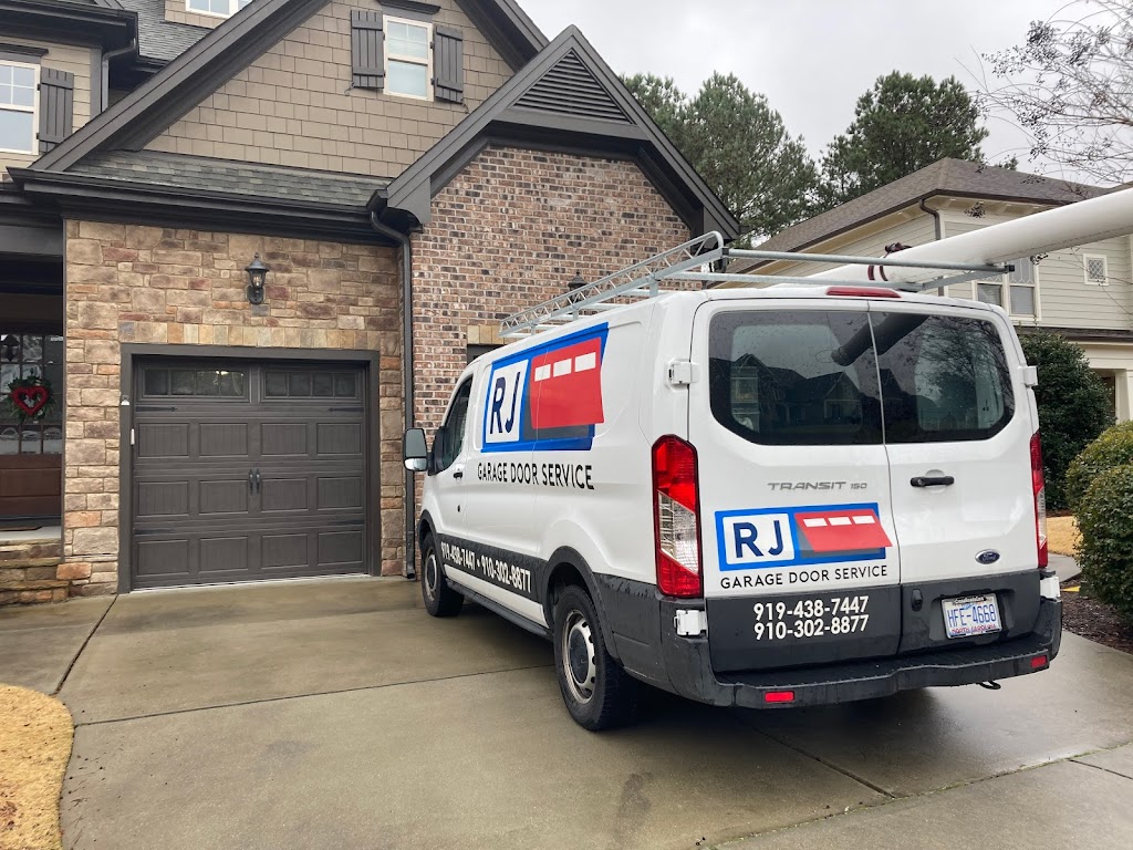 RJ Garage Door Service Car in front of a house