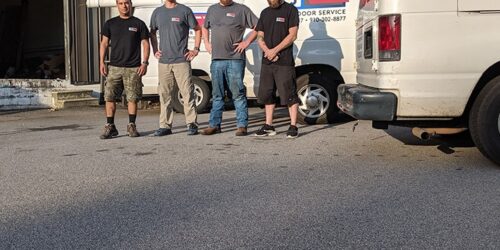 RJ Garage Door Service Team in front of the cars