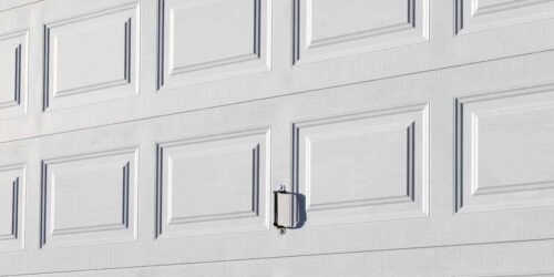 White closed garage door with handle