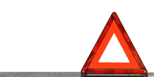 Red triangle, red emergency stop sign, red emergency symbol isolated on white background. With copy space for text or design.