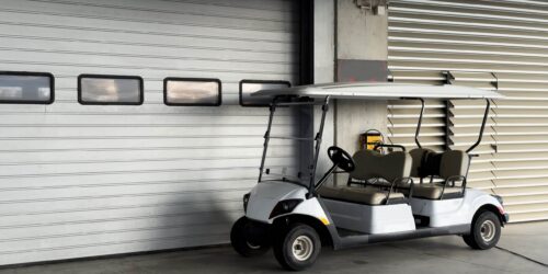 Mini storage facility with rows of units and a golf cart with handicap sign Mini storage facility with rows of units and a golf cart with handicap sign. High quality photo